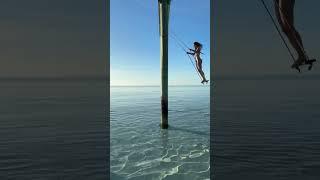 Dan Bilzerian girl swinging in sea