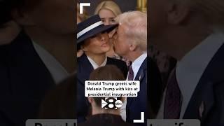 President Donald Trump gives wife, First Lady Melania Trump, a kiss at inauguration