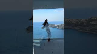 Millionaire girl enjoy on skyscraper balcony