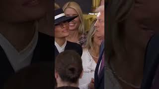 Trump's cheek kiss is blocked by Melania's hat